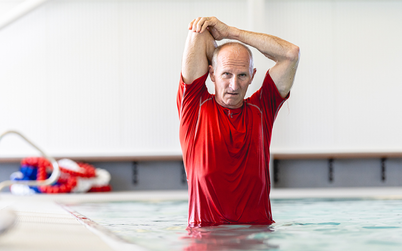 Man stretching in the hydrotherapy pool